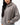 Emblem Womens Hoodie in Gray — front view on model showing the tonal Gracie Barra chest emblem and oversized fit, worn with light-wash jeans.