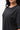 Emblem Womens Tee, black — front close-up of the tonal embroidered stacked Gracie Barra emblem on the chest.