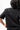 Emblem Womens Tee, black — back view showing the Legacy G triangle logo above a "JIU-JITSU" wordmark.