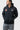 Black Equipe Zip Hoodie by adidas on a student, hood down, showing the adidas chest logo, red Barra Shield and Jiu-Jitsu sleeve print.