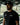 Man wearing black adidas x Gracie Barra Equipe t-shirt and cap in an outdoor training setting