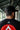 Rear view of man wearing black adidas snapback cap with “Equipe GB” and “Jiu-Jitsu” embroidery and black Gracie Barra t-shirt with large red GB logo outdoors
