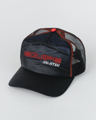 Black Equipe Motion Cap with curved visor, embroidered “Equipe Jiu-Jitsu” on the front panel, red mesh side panels with contrast stitching, and red button on top, laid flat against a white background.