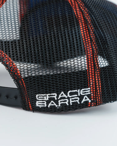 Close-up of black mesh Equipe Motion Cap with white “Gracie Barra” embroidery and red stitched paneling, photographed against a white background.