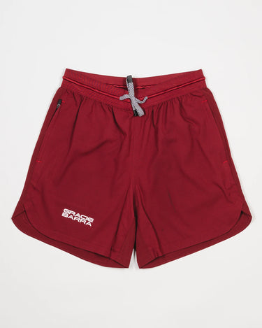 Equipe Motion Men’s Shorts in maroon with 6-inch inseam, elastic waistband, and reflective Gracie Barra logo on right leg.