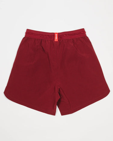 Back view of Equipe Motion Men’s Shorts in maroon with elastic waistband, grid-pattern ventilation, and a red Equipe tag.