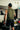 Back view of army green sleeveless tech tee with set-in armholes and a tonal Jiu-Jitsu print across the upper right back.