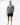 Flow Men's Tech Tee in dark grey, full-length front view on a male model with the white Gracie Barra Stacked logo on the left chest