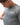 Flow Men's Tech Tee in dark grey, upper-body view of a model looking down and pinching the fabric, white Gracie Barra Stacked logo on the left chest