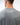 Flow Men's Tech Tee in dark grey, back close-up showing the white Brazilian Jiu-Jitsu graphic on the upper back