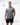 Flow Men's Tech Tee in dark grey, full-length front view on a male model standing with arms at his sides, white Gracie Barra Stacked logo on the left chest