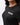Flow Women's Tech Tee in black, chest close-up showing the white Gracie Barra Stacked logo on the left chest and the crew neckline
