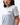 Flow Women's Tech Tee in light grey, upper-body three-quarter view on a female model with the dark Gracie Barra Stacked logo on the left chest
