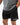 Frame Men's Short in black, lower-body front view with a hand in the side pocket, side hem vent, and the white Gracie Barra Stacked logo on the lower left leg