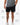 Frame Men's Short in black, lower-body front view on a male model with the white Gracie Barra Stacked logo on the lower left leg