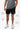 Frame Men's Short in black, lower-body front view on a male model with the white Gracie Barra Stacked logo on the lower left leg