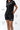 Frame Women's Short in black, three-quarter view on a female model, hand on hip, side hem vent and white Gracie Barra Stacked logo on the lower left leg