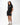 Frame Women's Short in black, full-length front view on a female model with one hand in the pocket, white Gracie Barra Stacked logo on the lower left leg