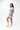 Frame Women's Short in light grey, side view on a female model with a hand in the side pocket, white Gracie Barra Stacked logo on the lower left leg