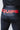 Close-up of the wide waistband on the black GB Essentials compression pants with large red EQUIPE lettering across the back