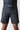 Model wearing black GB Essentials Velcro Training Shorts, front view showing Gracie Barra waistband patch