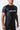 Man wearing the black GB Essentials Mesh Training Tee, angled front view showing the athletic fit and EQUIPE chest print