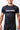 Man wearing the black GB Essentials Ranked Rashguard, front view showing the EQUIPE chest print and red contrast stitching