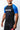 Man wearing the GB Essentials Ranked Rashguard in Blue - angled side view showing the Gracie Barra sleeve print