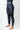 Three-quarter side view of the black GB Essentials Womens Compression Pants with the Edition script at the hip and EQUIPE print at the ankle.