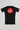 GB Essentials Women’s Ranked Rashguard in black, back view featuring the Gracie Barra Red Shield logo with geometric side panels and reinforced red stitching.