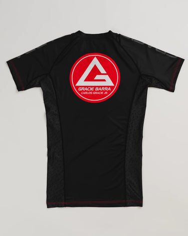 GB Essentials Women’s Ranked Rashguard in black, back view featuring the Gracie Barra Red Shield logo with geometric side panels and reinforced red stitching.