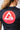 Close-up back view of the black GB Essentials Womens Ranked Rashguard showing the large red and white circular Gracie Barra Carlos Gracie Jr. Red Shield