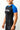 Side view of a woman wearing the GB Essentials Womens Ranked Rashguard in blue, showing textured side panel and Gracie Barra sleeve print