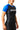 Three-quarter angle view of a woman in the GB Essentials Womens Ranked Rashguard in blue, showing EQUIPE chest print and fitted compression cut