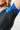 Close-up of the geometric textured side panel and seamless underarm construction on the GB Essentials Womens Ranked Rashguard in blue