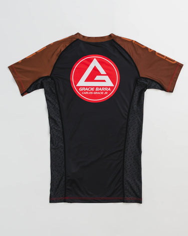 GB Essentials Women’s Ranked Rashguard in black with brown sleeves, featuring the Gracie Barra Red Shield logo on the back.