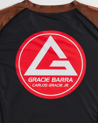 GB Essentials Women’s Brown Belt Ranked Rashguard back view featuring the Gracie Barra Red Shield logo.