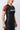 Close-up side detail of the GB Essentials Womens Ranked Rashguard, highlighting the textured black side panel, red stitching and Gracie Barra print on the brown sleeve.