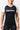 Woman wearing the GB Essentials Womens Ranked Rashguard in white, front view from the waist up showing the EQUIPE chest print and white raglan sleeves