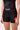 Front view of the black Close Contact Womens Compression Pants with the red Gracie Barra waistband wordmark and gray striped hip panels.