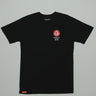 Black GB HQ 20th Anniversary Tee laid flat on a light gray background, featuring the red Barra Shield on the left chest and woven GB Wear label at the hem.