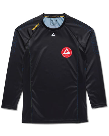 Black long-sleeve Gracie Barra x Vanguard Evolution rashguard with red Barra Shield logo on chest, tonal navy Vanguard branding on sleeves, and contrast stitching.