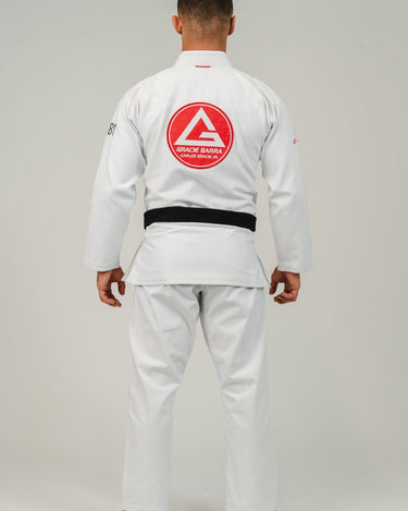 Back view of an adult athlete wearing the white GB1 Kimono, featuring the large Red Shield patch centered on the jacket and a clean, reinforced fit for training.