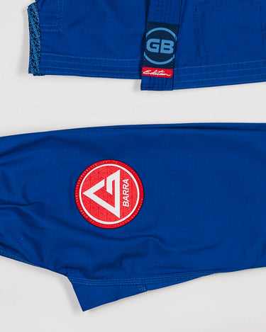 White belt and Red Shield patch detail on the pants of the blue kids’ kimono, with GB logo label at the bottom of the lapel