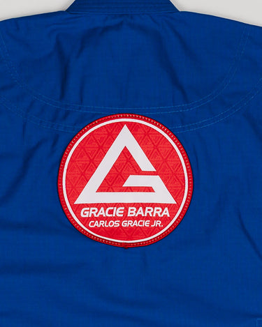 Large Red Shield patch stitched on the back of the blue kids’ kimono.