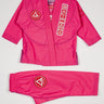 Pink GBK Lite Ripstop kids’ kimono set with Red Shield patches, a Gracie Barra lapel patch, and a GB label at the bottom of the lapel. Jacket and pants are shown clearly to help parents see the fit, color, and details perfect for young girls starting their Jiu-Jitsu journey.