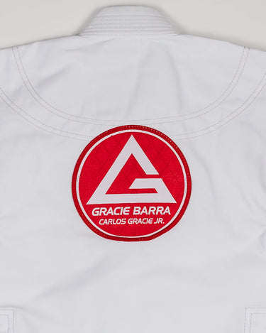 Close-up of large Red Shield patch stitched on the back of the white kids’ kimono.