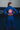 Back view of female athlete wearing blue GB x adidas III Stripes Women’s Kimono on blue mats, featuring large Red Shield patch, red EQUIPE GB patch, and red 3-Stripes on pant legs.