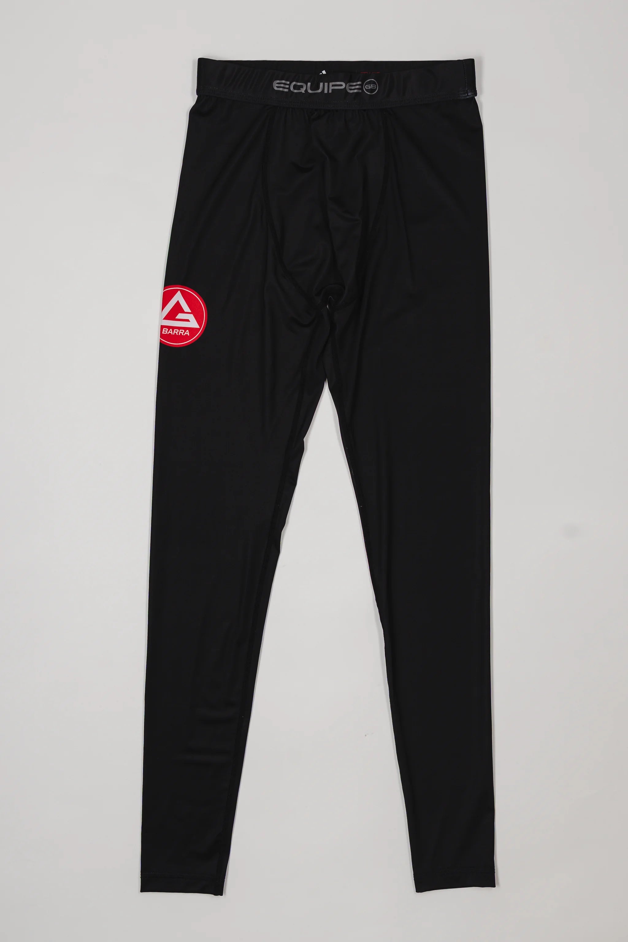 Black III Stripes Compression Pants by adidas featuring the red Gracie Barra patch on the thigh and EQUIPE waistband branding, displayed on a light background.