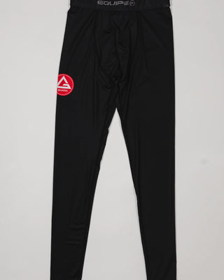 Black III Stripes Compression Pants by adidas featuring the red Gracie Barra patch on the thigh and EQUIPE waistband branding, displayed on a light background.